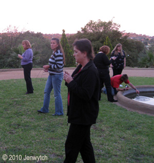 (L to R) Amethyst, Jenni & Jenny dowsing with L-rods. Janine, Heather & Wayne investigating the fountain.